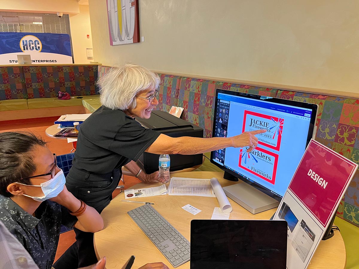 Jackie and Castor work on business cards